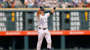 Jul 24, 2024; Denver, Colorado, USA; Colorado Rockies first baseman Michael Toglia (4) reacts to hitting a two-RBI double in the fourth inning against the Boston Red Sox at Coors Field.