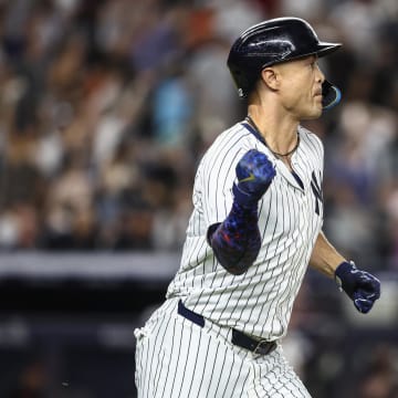 New York Yankees designated hitter Giancarlo Stanton (27) hits a three-run home run in the seventh inning against the Baltimore Orioles at Yankee Stadium on June 19.