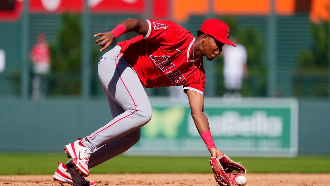 Sep 21, 2025; Denver, Colorado, USA; Los Angeles Angels shortstop Denzer Guzman (13) fields the ball in the fifth inning against the Colorado Rockies at Coors Field. Mandatory Credit: Ron Chenoy-Imagn Images