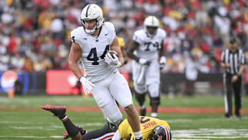 Nov 4, 2023; College Park, Maryland, USA;  Penn State Nittany Lions tight end Tyler Warren (44) runs by Penn State Nittany Lions safety Keaton Ellis (2) during the first half at SECU Stadium. 
