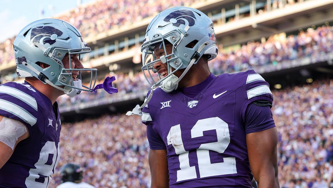 Sep 6, 2025; Manhattan, Kansas, USA; Kansas State Wildcats wide receiver Jaron Tibbs (12) and tight end Garrett Oakley (86) celebrate a touchdown catch by Tibbs during the second quarter against the Army Black Knights at Bill Snyder Family Football Stadium. Mandatory Credit: Scott Sewell-Imagn Images Sep 6, 2025; Manhattan, Kansas, USA; Kansas State Wildcats wide receiver Jaron Tibbs (12) and tight end Garrett Oakley (86) celebrate a touchdown catch by Tibbs during the second quarter against the Army Black Knights at Bill Snyder Family Football Stadium. Mandatory Credit: Scott Sewell-Imagn Images