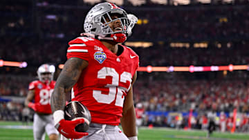 Jan 10, 2025; Arlington, TX, USA; Ohio State Buckeyes running back TreVeyon Henderson (32) celebrates during the game between the Texas Longhorns and the Ohio State Buckeyes at AT&T Stadium. Mandatory Credit: Jerome Miron-Imagn Images