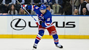 May 30, 2024; New York, New York, USA; New York Rangers left wing Artemi Panarin (10) lines up a shot against the Florida Panthers during the first period in game five of the Eastern Conference Final of the 2024 Stanley Cup Playoffs at Madison Square Garden. Mandatory Credit: Dennis Schneidler-Imagn Images