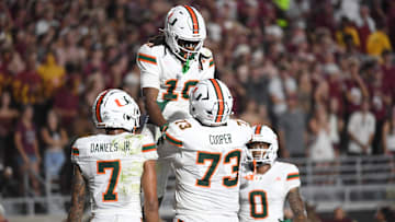 Oct 4, 2025; Tallahassee, Florida, USA; Miami Hurricanes wide receiver Malachi Toney (10) celebrates with teammates after scoring a touchdown during the second half against the Florida State Seminoles at Doak S. Campbell Stadium. Mandatory Credit: Robert Myers-Imagn Images