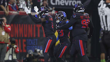 Dec 15, 2024; Houston, Texas, USA; Houston Texans cornerback Kamari Lassiter (4) celebrates after a safety during the second quarter against the Baltimore Ravens at NRG Stadium. Mandatory Credit: Troy Taormina-Imagn Images