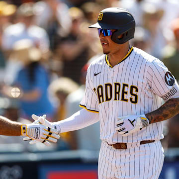Sep 3, 2025; San Diego, California, USA; San Diego Padres third baseman Manny Machado (13) celebrates with left fielder Ramon Laureano (5) after hitting a two-run home run during the sixth inning against the Baltimore Orioles at Petco Park. Mandatory Credit: David Frerker-Imagn Images
