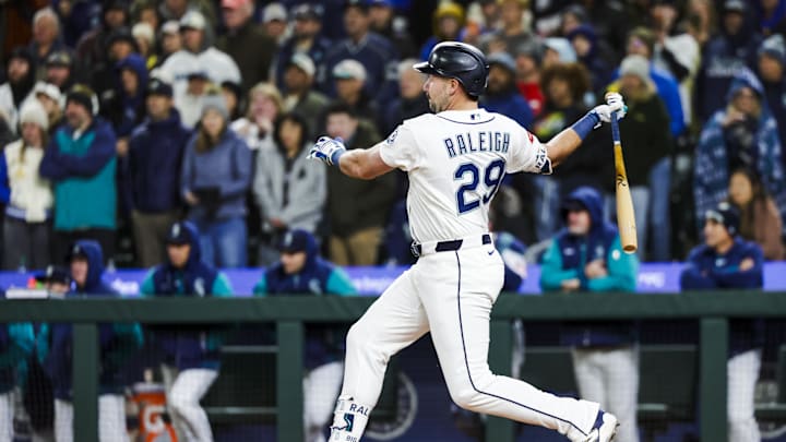 Mar 30, 2026; Seattle, Washington, USA; Seattle Mariners catcher Cal Raleigh (29) hits a walk-off RBI-single against the New York Yankees during the ninth inning at T-Mobile Park. Mandatory Credit: Joe Nicholson-Imagn Images