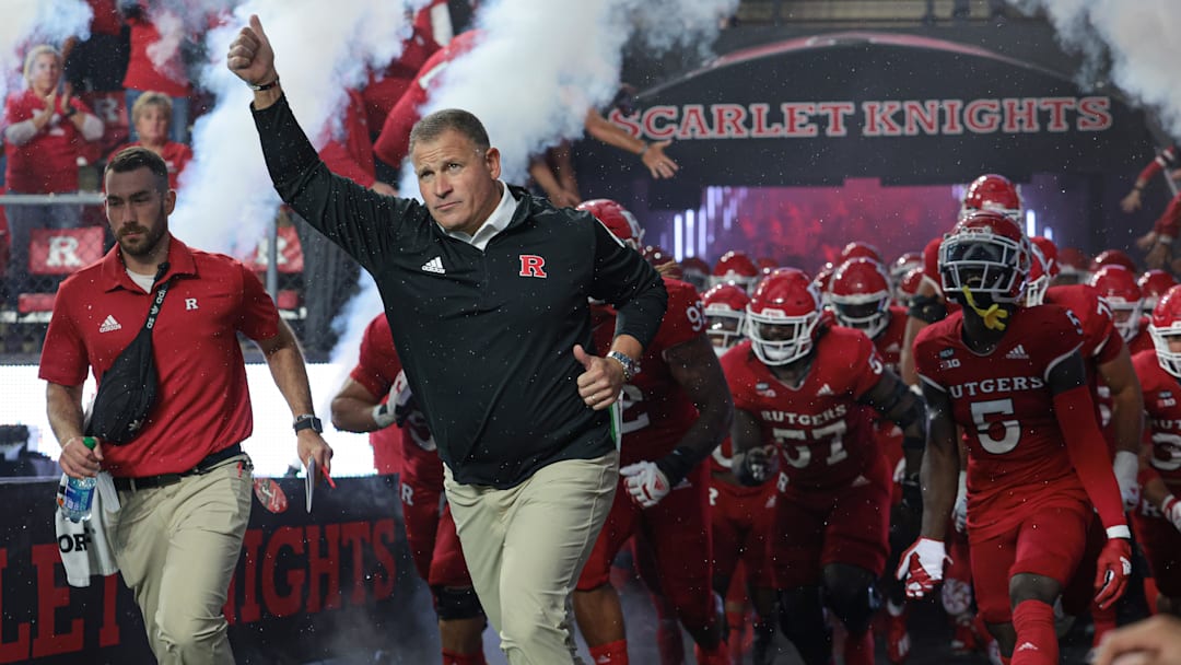 Sep 24, 2022; Piscataway, New Jersey, USA; Rutgers Scarlet Knights head coach Greg Schiano leads the Scarlet Knights football team onto the field before a game against the Iowa Hawkeyes at SHI Stadium. Mandatory Credit: Vincent Carchietta-Imagn Images Sep 24, 2022; Piscataway, New Jersey, USA; Rutgers Scarlet Knights head coach Greg Schiano leads the Scarlet Knights football team onto the field before a game against the Iowa Hawkeyes at SHI Stadium. Mandatory Credit: Vincent Carchietta-Imagn Images