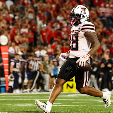  Texas Tech Red Raiders running back Tahj Brooks scores a touchdown against Arizona Wildcats.