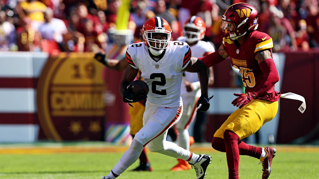 Oct 6, 2024; Landover, Maryland, USA; Cleveland Browns wide receiver Amari Cooper (2) runs the ball against a catch against Washington Commanders cornerback Benjamin St-Juste (25) during the second quarter at NorthWest Stadium.
