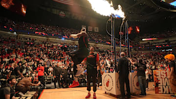 Jan 4, 2025; Miami, Florida, USA;  Miami Heat center Bam Adebayo, left, leaps into the air after warming-up with the help of center Kel'el Ware (7) before the game against the Utah Jazz at Kaseya Center. Mandatory Credit: Jim Rassol-Imagn Images