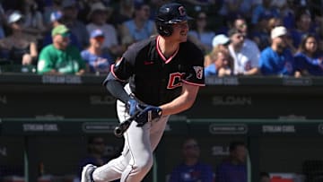 Mar 1, 2025; Mesa, Arizona, USA; Cleveland Guardians first base Kyle Manzardo (9) hits a single against the Chicago Cubs in the first inning at Sloan Park. Mandatory Credit: Rick Scuteri-Imagn Images