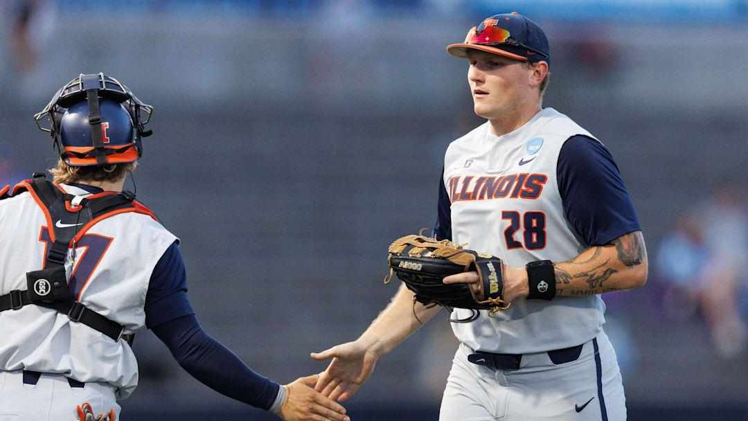 May 31, 2024; Lexington, KY, USA; Illinois infielder Vytas Valincius (28) returns to the dugout during the sixth inning of a NCAA Division I Baseball Championship game between the Indiana State Sycamores and Illinois Fighting Illini at Kentucky Proud Park. Mandatory Credit: Jordan Prather-Imagn Images