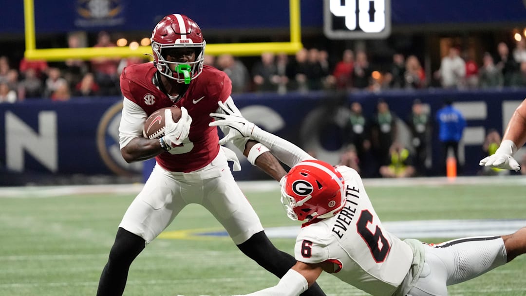 Dec 6, 2025; Atlanta, GA, USA; Alabama wide receiver Germie Bernard (5) evades a tackle by Georgia defensive back Daylen Everette (6) at Mercedes-Benz Stadium. Mandatory Credit: Gary Cosby Jr.-Tuscaloosa News