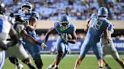 Nov 22, 2025; Chapel Hill, North Carolina, USA; North Carolina Tar Heels running back Davion Gause (37) rushes the ball against Duke during the second half at Kenan Stadium. Mandatory Credit: William Howard-Imagn Images
