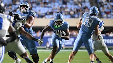 Nov 22, 2025; Chapel Hill, North Carolina, USA; North Carolina Tar Heels running back Davion Gause (37) rushes the ball against Duke during the second half at Kenan Stadium. Mandatory Credit: William Howard-Imagn Images