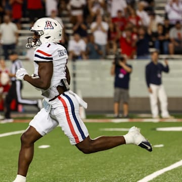 Aug 31, 2024; Tucson, Arizona, USA; Arizona Wildcats running back Jacory Croskey-Merritt (1) runs the ball for a touchdown during fourth quarter at Arizona Stadium. 