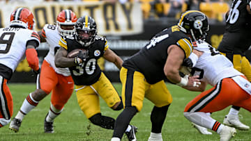Oct 12, 2025; Pittsburgh, Pennsylvania, USA; Pittsburgh Steelers running back Jaylen Warren (30) attempts to run the ball during the second quarter at Acrisure Stadium. Mandatory Credit: Barry Reeger-Imagn Images