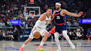 Apr 24, 2025; Inglewood, California, USA; Denver Nuggets center Nikola Jokic (15) moves to the basket against Los Angeles Clippers guard Ben Simmons (25) during the first half of game three in the first round for the 2024 NBA Playoffs at Intuit Dome. Mandatory Credit: Gary A. Vasquez-Imagn Images
