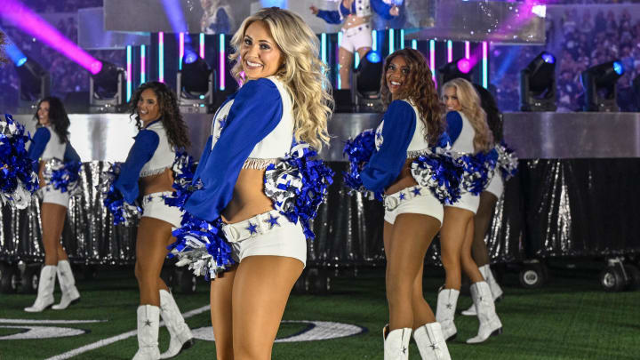 Nov 23, 2023; Arlington, Texas, USA; Singer Dolly Parton performs with the Dallas Cowboys cheerleaders during halftime in the game between the Cowboys and the Washington Commanders at ATT Stadium. 