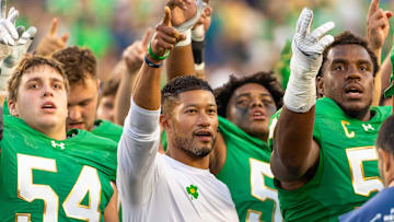 Notre Dame head football coach Marcus Freeman sings the Notre Dame Alma Mater after beating the Boise State Broncos at Notre Dame Stadium. 