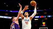 Clippers center Ivica Zubac shoots the ball against Phoenix Suns forward Drew Eubanks during a game at Footprint Center.