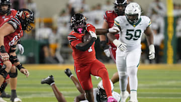 Nov 15, 2025; Waco, Texas, USA;  Utah Utes running back Wayshawn Parker (1) carries the ball ahead of Baylor Bears linebacker Kyland Reed (45) during the second half at McLane Stadium. Mandatory Credit: Chris Jones-Imagn Images