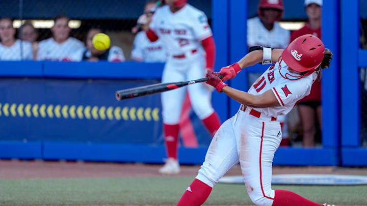 Texas Tech infielder Lauren Allred (11) hits a single in the fifth inning during a softball game between Texas Tech and UCLA at the Women’s College World Series at Devon Park in Oklahoma City, on Saturday, May 31, 2025.