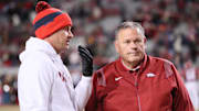 Ole Miss Rebels head coach Lane Kiffin talks to Arkansas Razorbacks head coach Sam Pittman prior to the game at Donald W. Reynolds Razorback Stadium. 