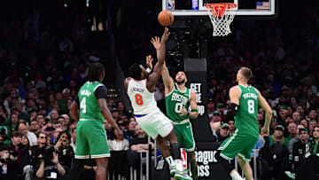 Feb 23, 2025; Boston, Massachusetts, USA;  New York Knicks forward OG Anunoby (8) shoots the ball over Boston Celtics forward Jayson Tatum (0) during the second half at TD Garden. Mandatory Credit: Bob DeChiara-Imagn Images