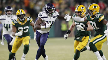 Jan 12, 2020; Green Bay, WI, USA; Seattle Seahawks wide receiver D.K. Metcalf (14) tries to get away from Green Bay Packers strong safety Adrian Amos (31)  in the third quarter of a NFC Divisional Round playoff football game at Lambeau Field. Mandatory Credit: Jeff Hanisch-Imagn Images