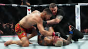Ilia Topuria fights Charles Oliveira during UFC 317 at T-Mobile Arena. 