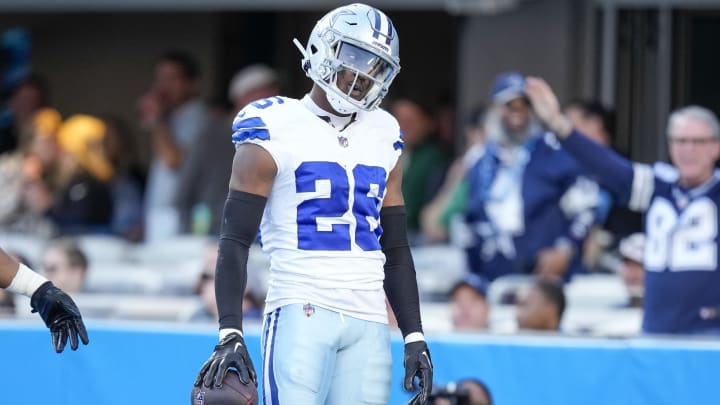 Nov 19, 2023; Charlotte, North Carolina, USA;  Dallas Cowboys cornerback DaRon Bland (26) celebrates his score in the end zone against the Carolina Panthers during the second half at Bank of America Stadium. Mandatory Credit: Jim Dedmon-USA TODAY Sports