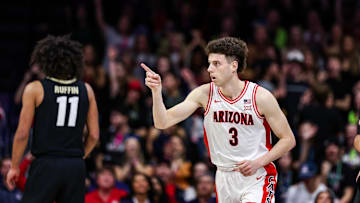 Jan 25, 2025; Tucson, Arizona, USA; Arizona Wildcats guard Anthony Dell’Orso (3) points after he made a three pointer during the first half of the game against the Colorado Buffaloes at McKale Center. Mandatory Credit: Aryanna Frank-Imagn Images