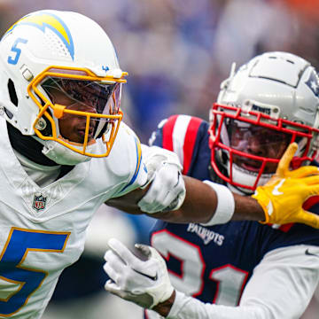 Los Angeles Chargers wide receiver Joshua Palmer runs the ball against New England Patriots cornerback Jonathan Jones in the first quarter at Gillette Stadium. 