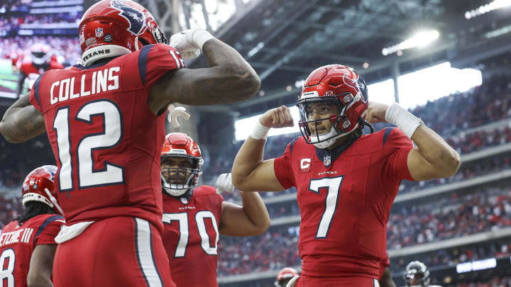 Nov 26, 2023; Houston, Texas, USA; Houston Texans quarterback C.J. Stroud (7) celebrates with wide receiver Nico Collins (12) after a touchdown during the fourth quarter against the Jacksonville Jaguars at NRG Stadium. Mandatory Credit: Troy Taormina-USA TODAY Sports