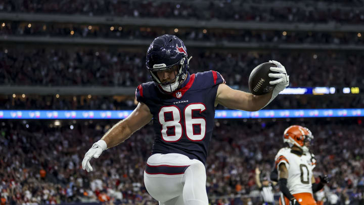 Jan 13, 2024; Houston, Texas, USA; Houston Texans tight end Dalton Schultz (86) scores a touchdown during the second quarter in a 2024 AFC wild card game at NRG Stadium. Mandatory Credit: Troy Taormina-USA TODAY Sports