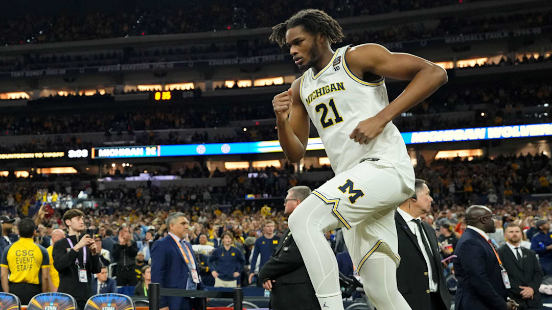 Apr 6, 2026; Indianapolis, IN, USA; Michigan Wolverines forward Morez Johnson Jr. (21) runs onto the court.