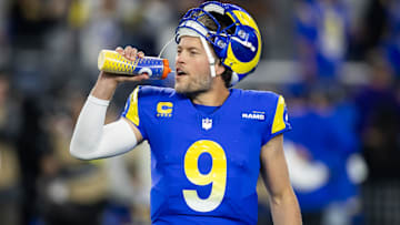 Los Angeles Rams quarterback Matthew Stafford (9) drinks from a Gatorade bottle against the Minnesota Vikings during an NFC wild card game at State Farm Stadium.