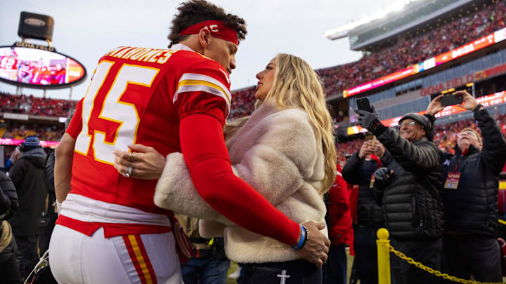 Kansas City Chiefs quarterback Patrick Mahomes (15) and wife Brittany Mahomes kiss before the AFC Championship game against the Buffalo Bills at GEHA Field at Arrowhead Stadium. Kansas City Chiefs quarterback Patrick Mahomes (15) and wife Brittany Mahomes kiss before the AFC Championship game against the Buffalo Bills at GEHA Field at Arrowhead Stadium.