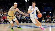 Mar 13, 2025; Charlotte, NC, USA; Duke Blue Devils forward Cooper Flagg (2) with the ball as Georgia Tech Yellow Jackets forward Duncan Powell (31) defends in the first half at Spectrum Center. Mandatory Credit: Bob Donnan-Imagn Images