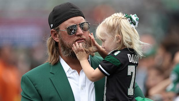 Nick Mangold holds his daughter