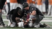 Texas A&M Aggies medical staff attends to quarterback Marcel Reed (10) during the first half against the Texas Longhorns at Darrell K Royal-Texas Memorial Stadium. Mandatory Credit: Scott Wachter-Imagn Images