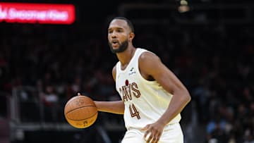 Nov 29, 2024; Atlanta, Georgia, USA; Cleveland Cavaliers forward Evan Mobley (4) dribbles the ball in the game against the Cleveland Cavaliers during the fourth quarter at State Farm Arena. Mandatory Credit: Jordan Godfree-Imagn Images