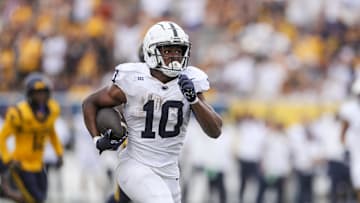 Aug 31, 2024; Morgantown, West Virginia, USA; Penn State Nittany Lions running back Nicholas Singleton (10) runs the ball for a touchdown.