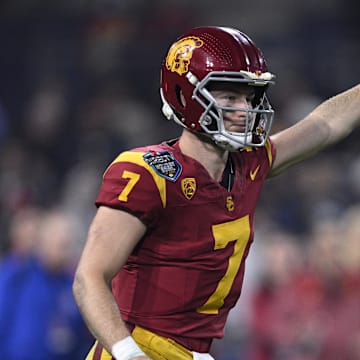 Dec 27, 2023; San Diego, CA, USA; USC Trojans quarterback Miller Moss (7) gestures during a running play against the Louisville Cardinals in the second half at Petco Park. Mandatory Credit: Orlando Ramirez-Imagn Images