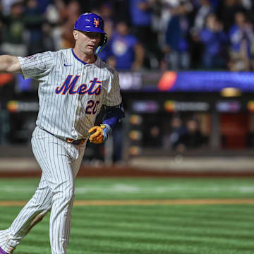 Sep 3, 2024; New York City, New York, USA;  New York Mets first baseman Pete Alonso (20) hits a two-run home run in the eighth inning against the Boston Red Sox at Citi Field. Mandatory Credit: Wendell Cruz-Imagn Images