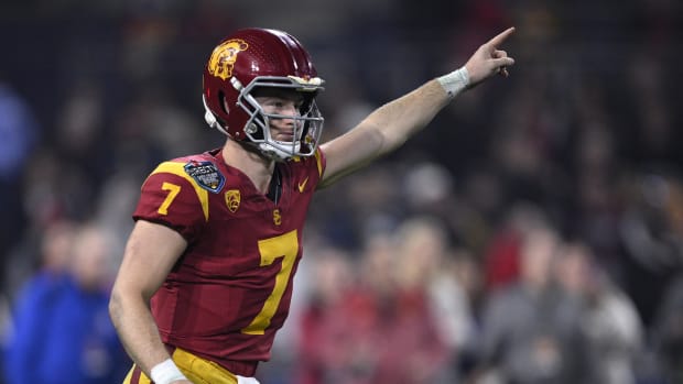 USC Trojans quarterback Miller Moss (7) gestures during a running play 