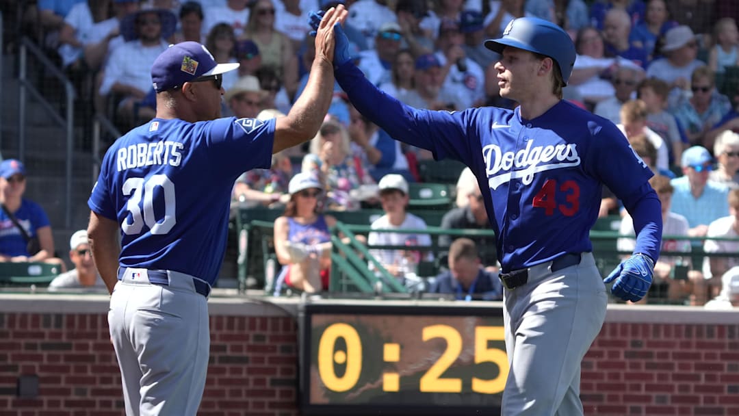 Mar 15, 2026; Mesa, Arizona, USA; Los Angeles Dodgers right fielder Jack Suwinski celebrates with manager Dave Roberts (30) after hitting a three run home run against the Chicago Cubs in the first inning at Sloan Park. Mandatory Credit: Rick Scuteri-Imagn Images
