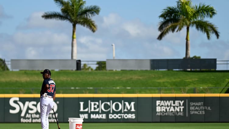 Feb 22, 2023; North Port, FL, USA; Atlanta Braves third base coach Ron Washington (37) watches the